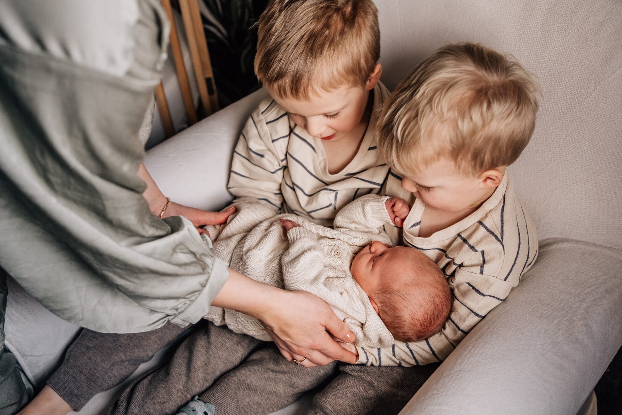 brothers-holding-baby